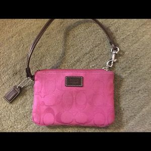 Pink coach wristlet.